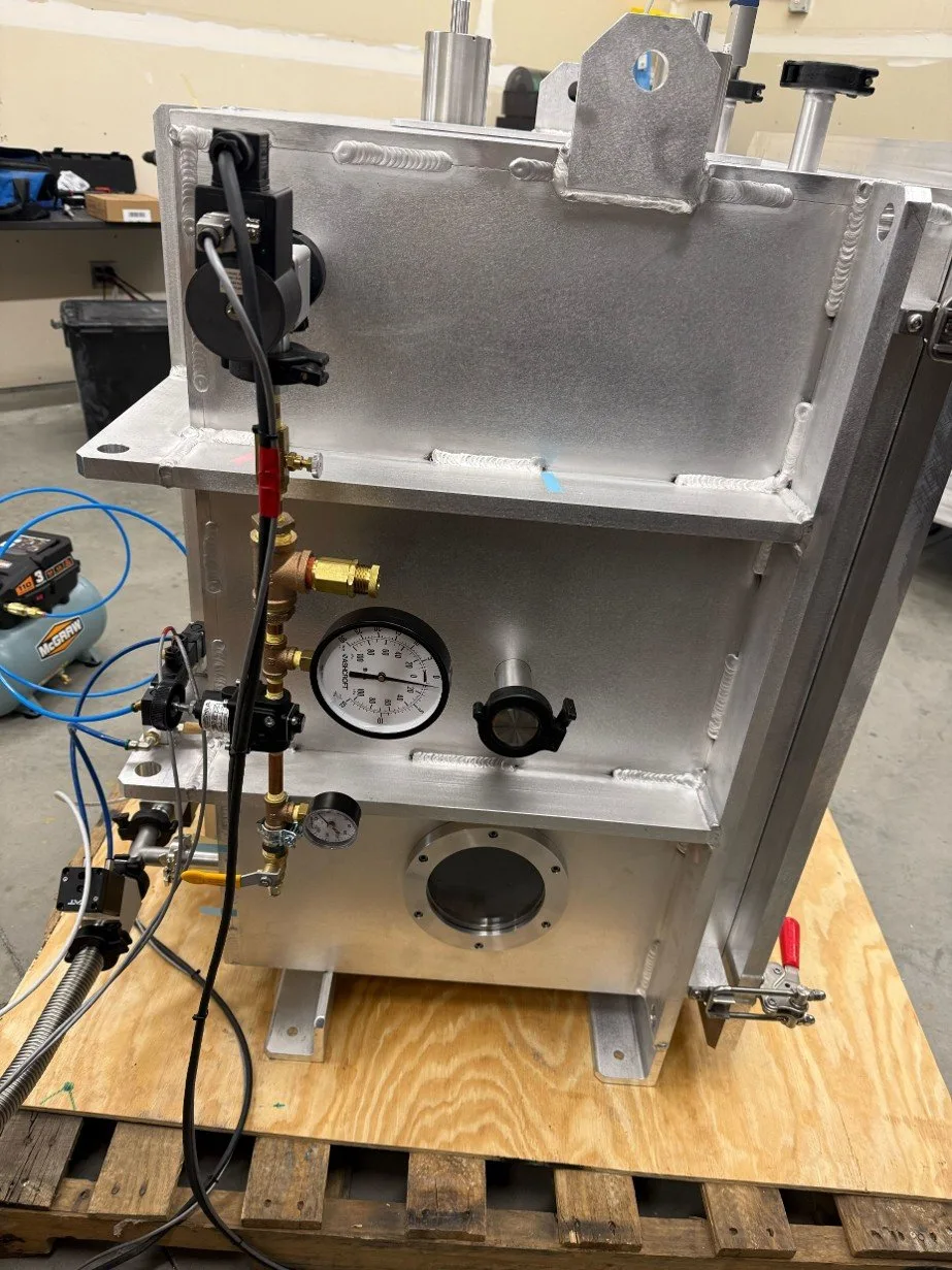 Vacuum chamber interior with lit viewport