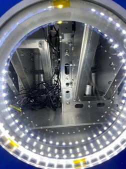 Specimen fixtures viewed through the chamber viewport