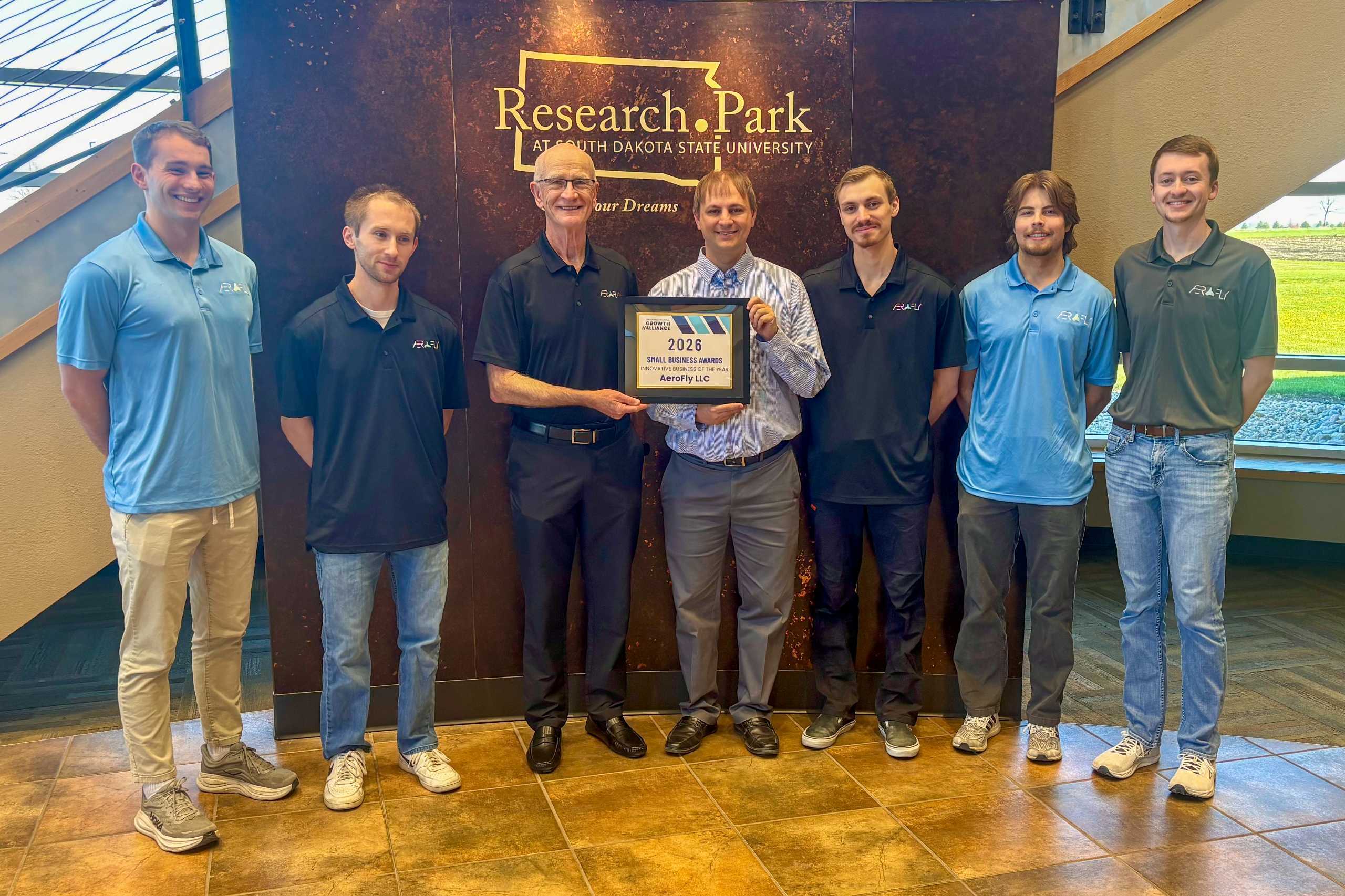 The AeroFly team accepting the 2026 Innovative Business of the Year award