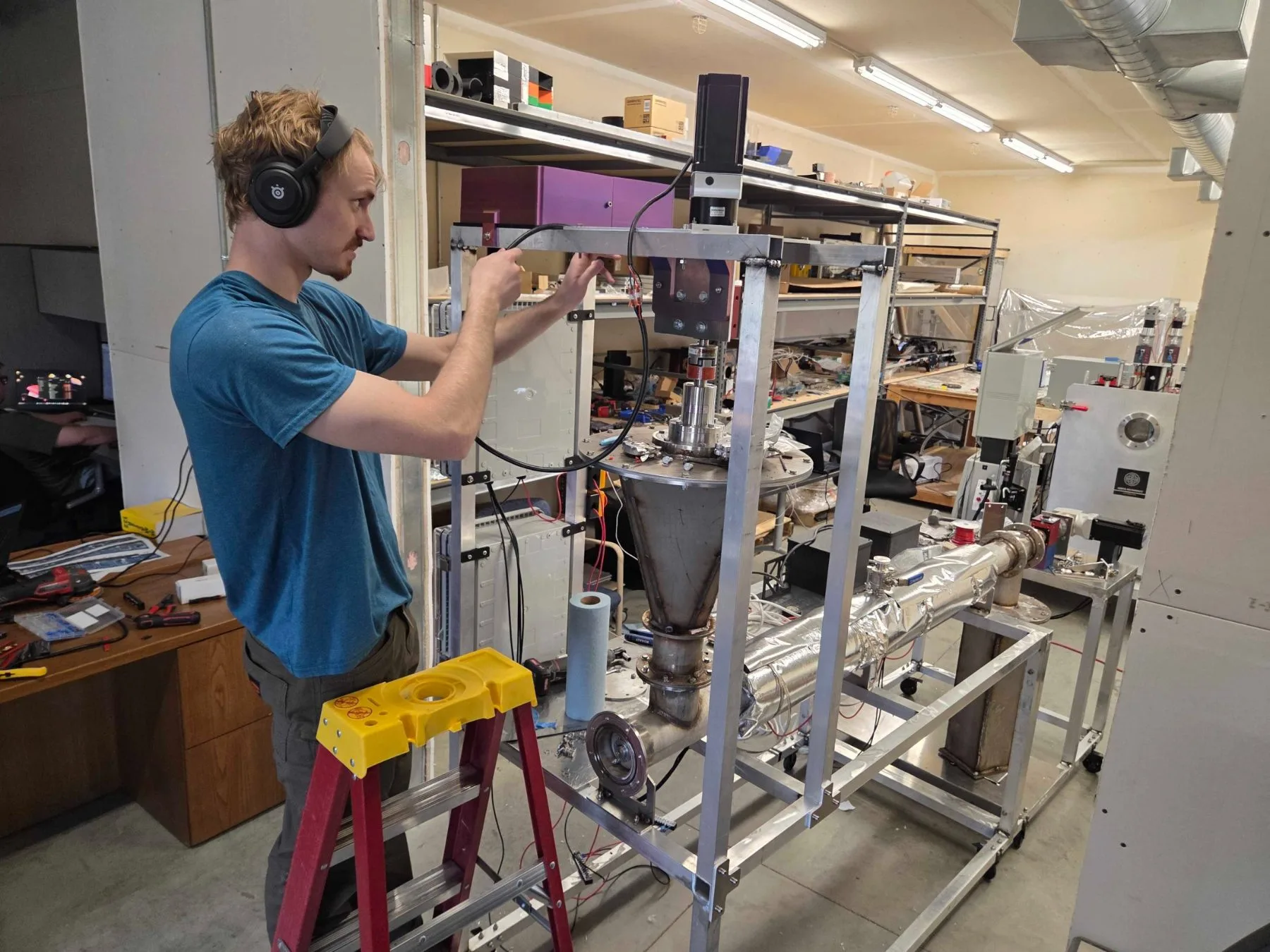 AeroFly engineer assembling the VADER auger-dryer testbench